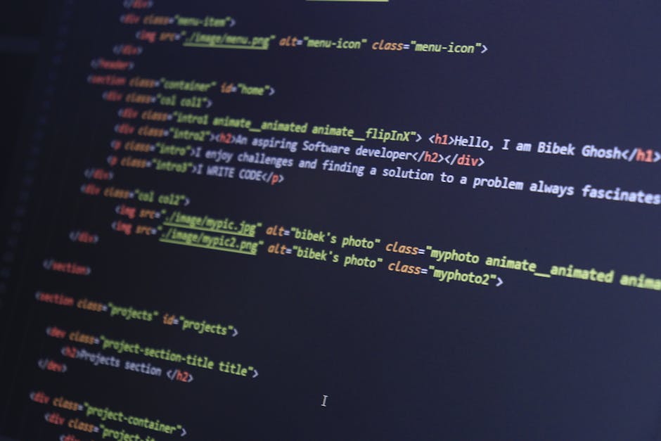 A close-up view of a computer screen displaying lines of programming code with various syntax highlighting in colors such as red, green, blue, yellow, and white. The code consists of text with symbols